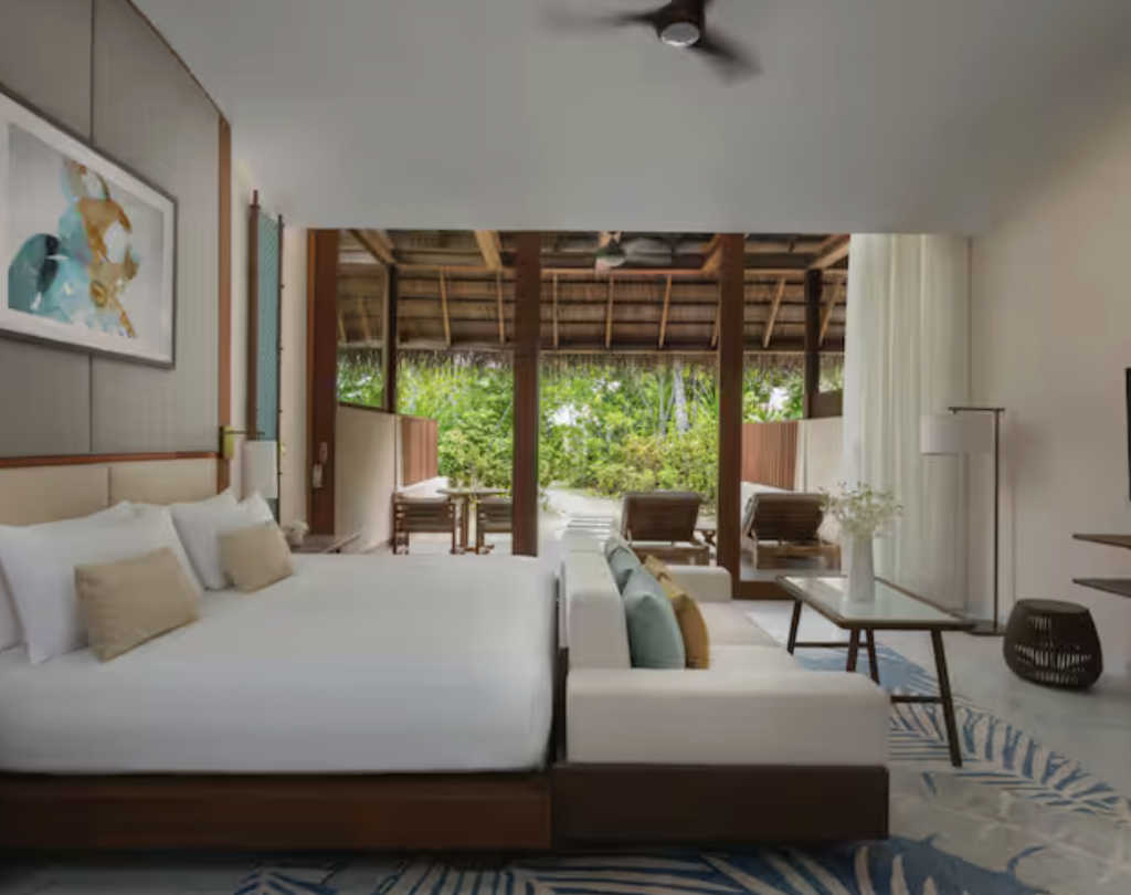 Spacious guest room with a king-size bed at Conrad Maldives Rangali Island